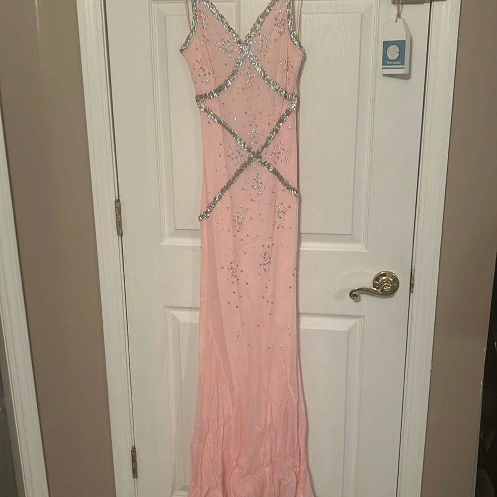 Formal, prom dress very slim .  More of a coral color .  Beaded work